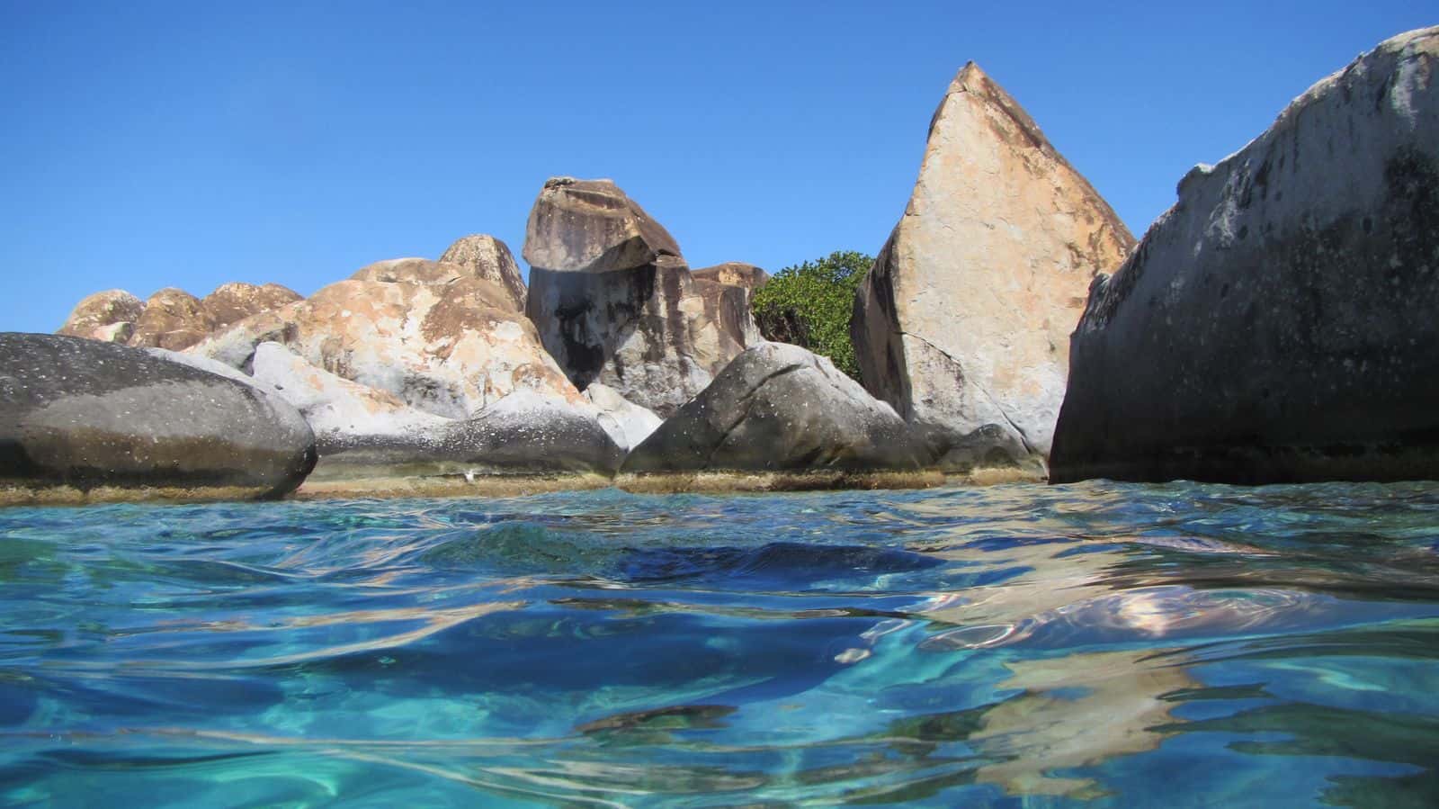 Granite boulders at The Baths on Virgin Gorda, seen from the water, west of Crook Bay