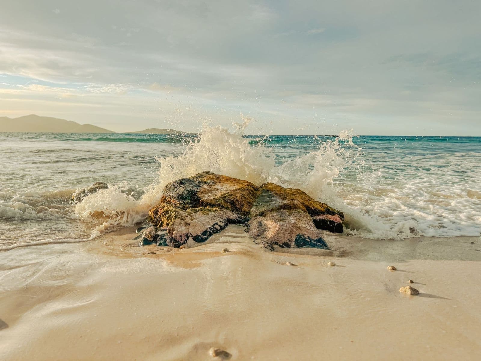 Small waves breaking on the rocks of a Tortola beach