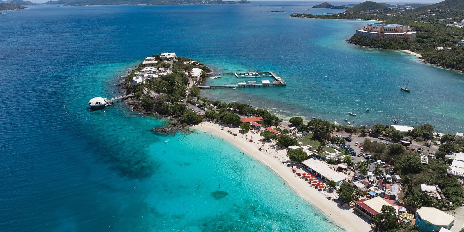 Aerial view of Coki Point and Coki Beach, St. Thomas, with the marine park's piers and the East End beyond.