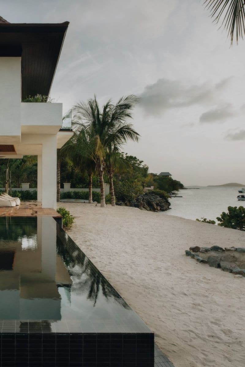 Indo House, Great Cruz Bay. The pool runs to the sand.